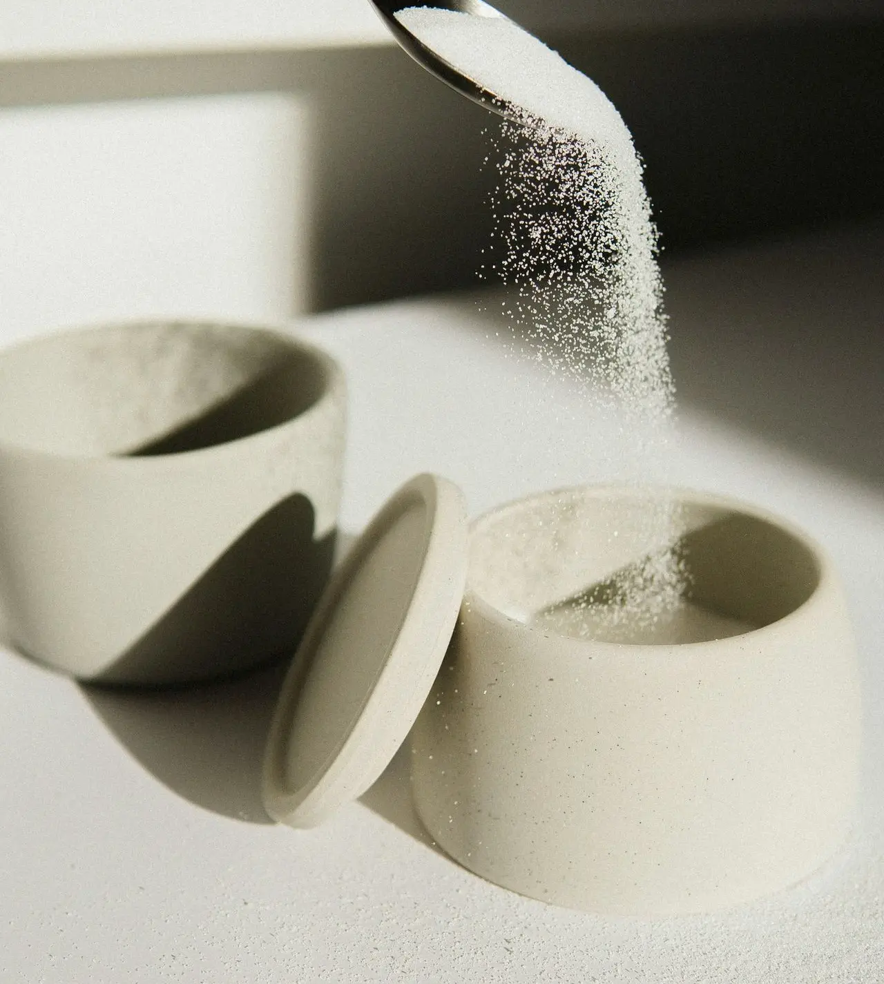 white ceramic bowl on white table
